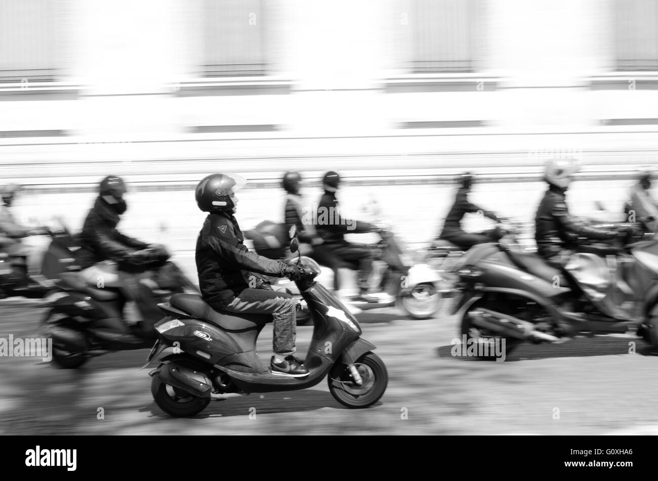 Fast mopeds/scooters in traffic Stock Photo
