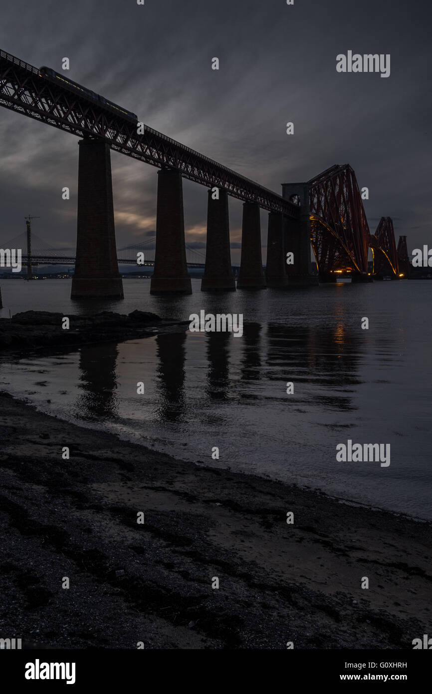 Dark, brooding shot of Forth Rail Bridge over the Firth of Forth, South Queensferry near Edinburgh, Lothian, Scotland Stock Photo