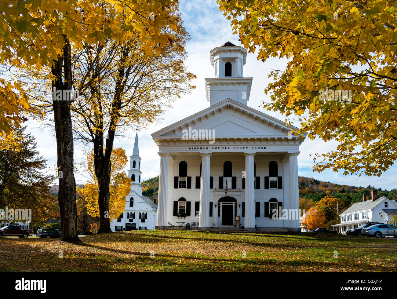 Autumn image of foliage in Newfane, Vermont of court house and church with bright color late in the afternoon. Stock Photo
