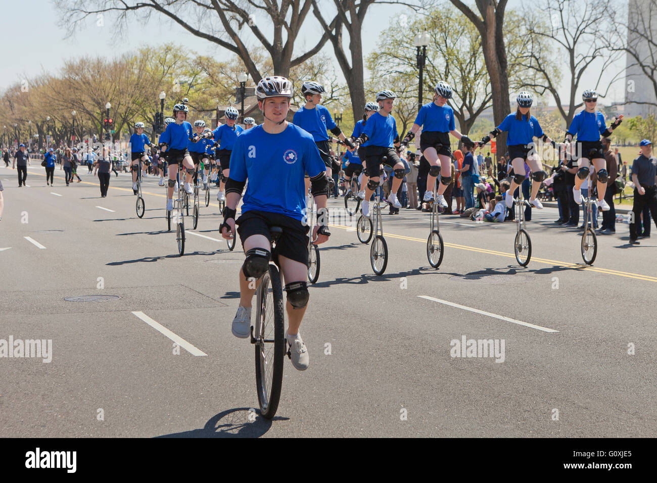Unicycle riders (unicyclists) at a cultural festival street parade