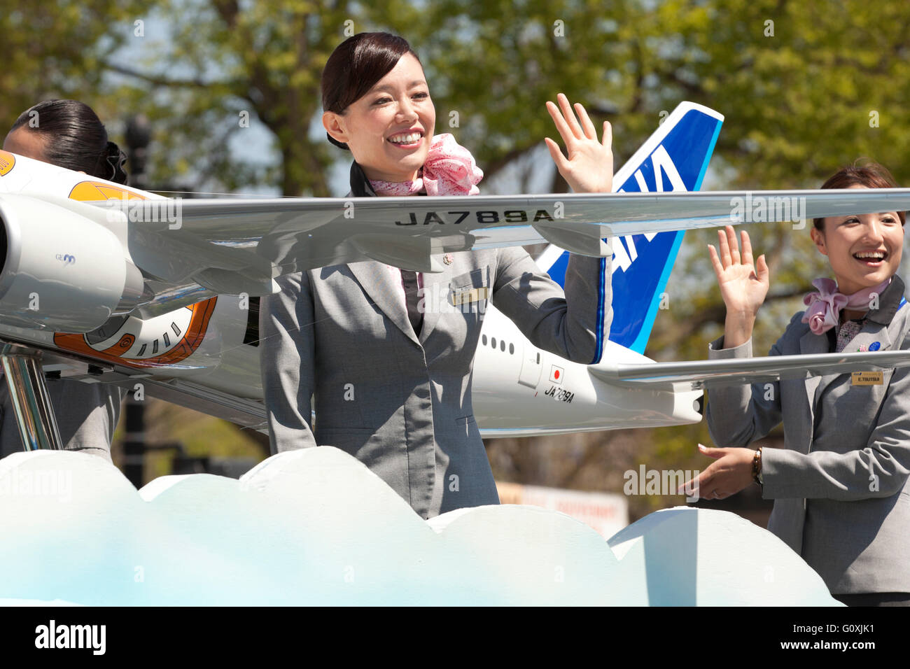 ANA Airlines flight attendant on a parade float - USA Stock Photo