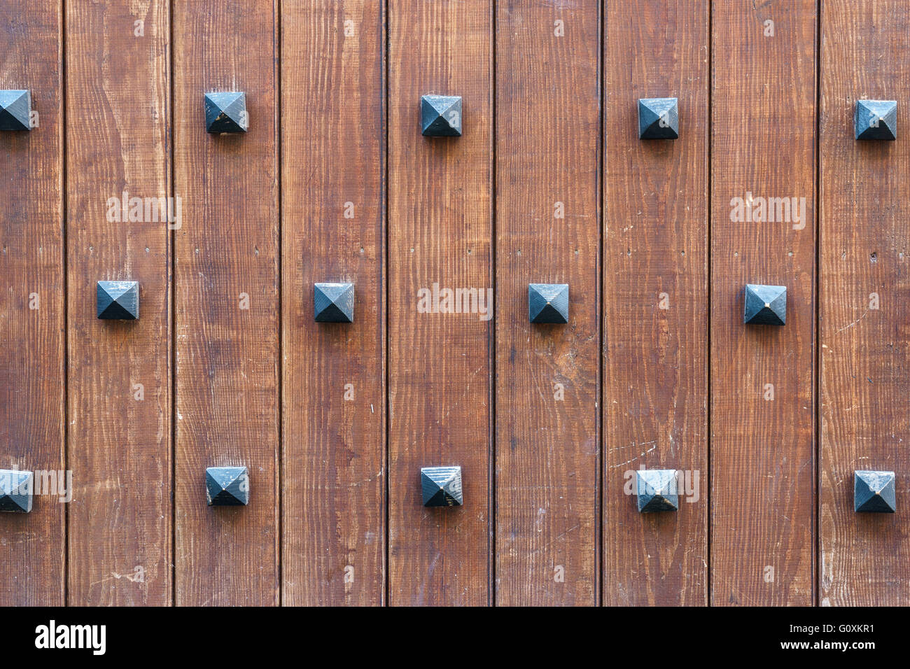 Old medieval time wall with decorative rivets, wooden plank background  Stock Photo - Alamy