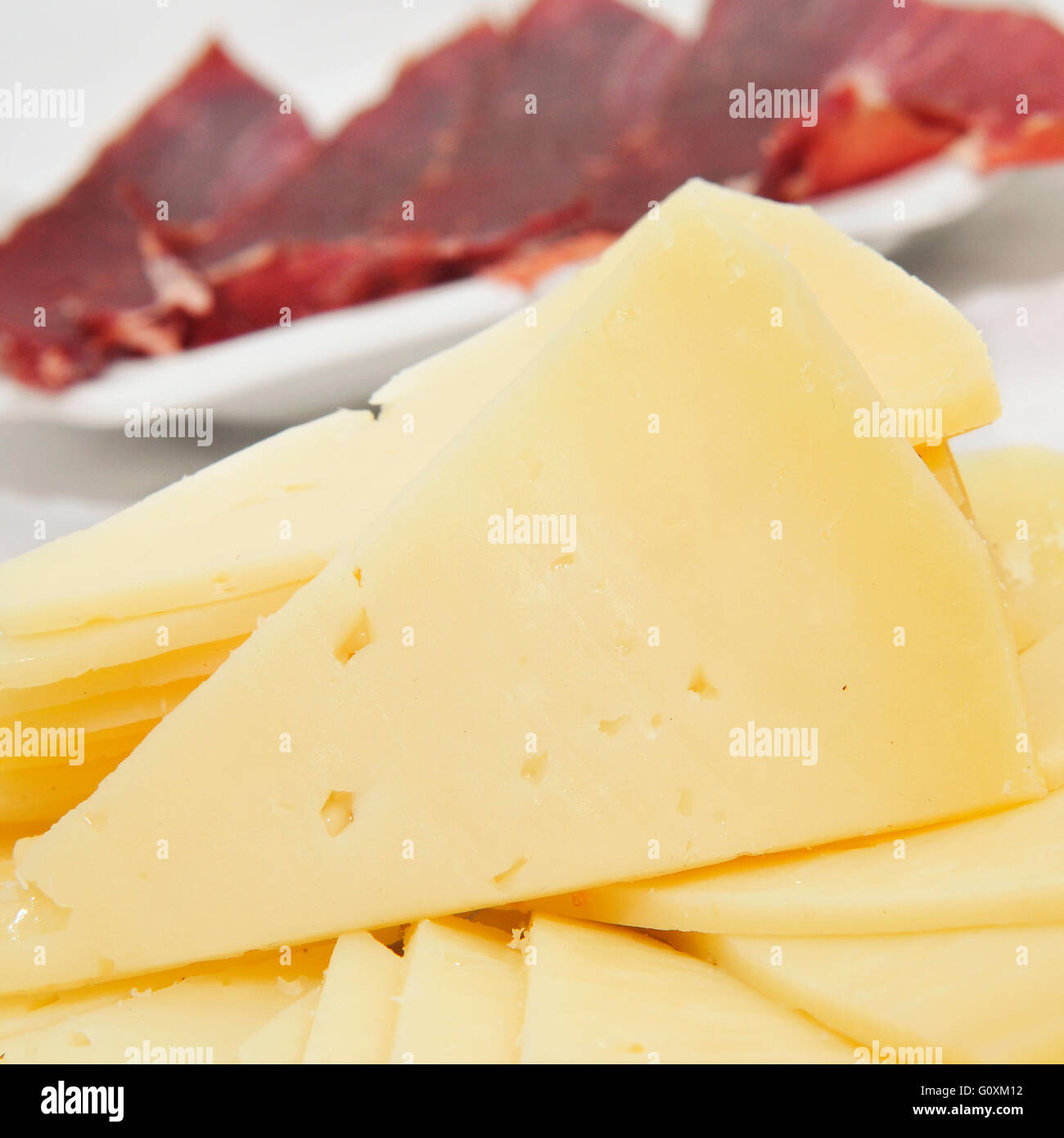 closeup of some spanish serrano ham and manchego cheese tapas Stock Photo -  Alamy
