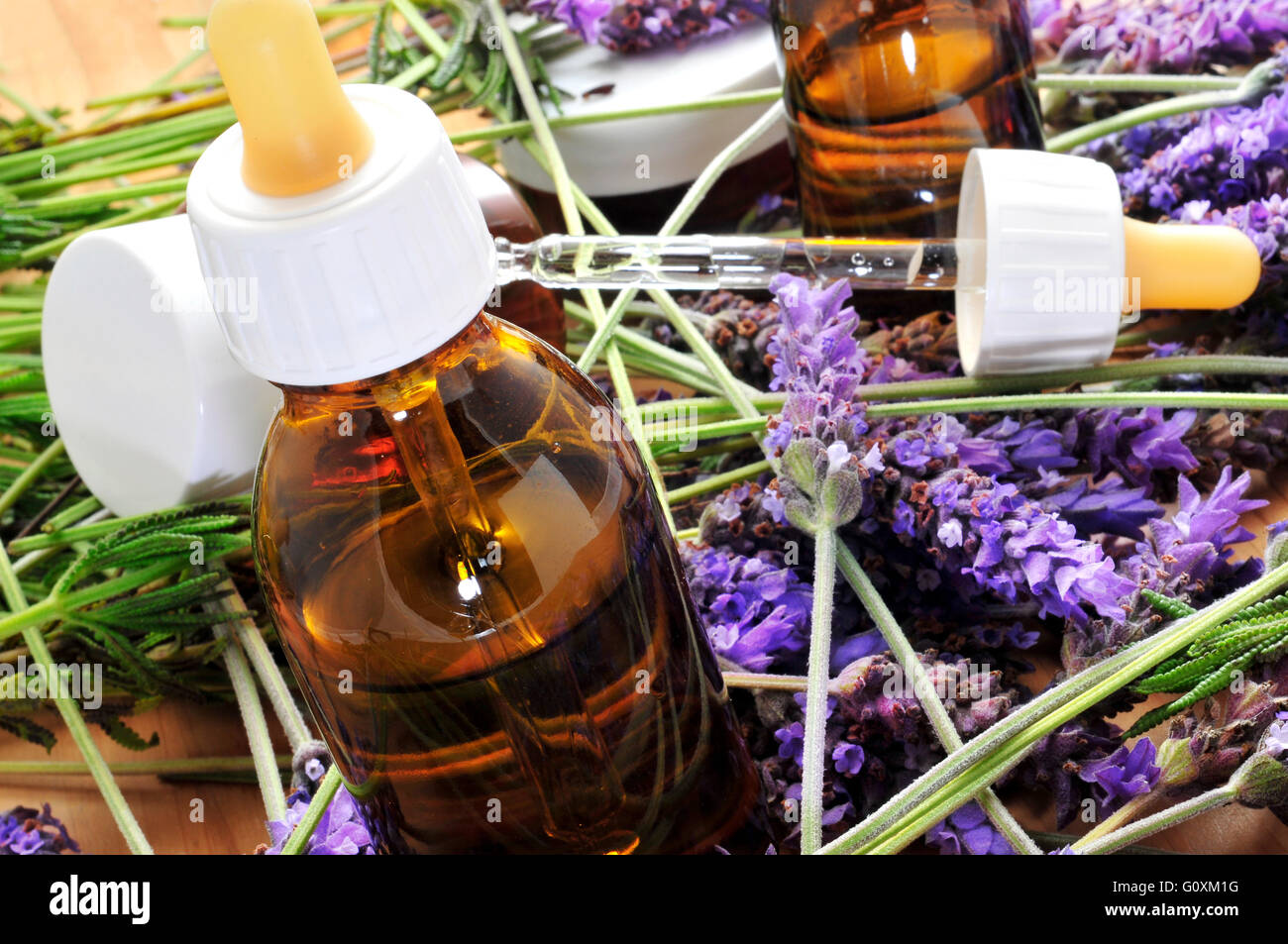 aromatherapy oil and lavender flowers Stock Photo