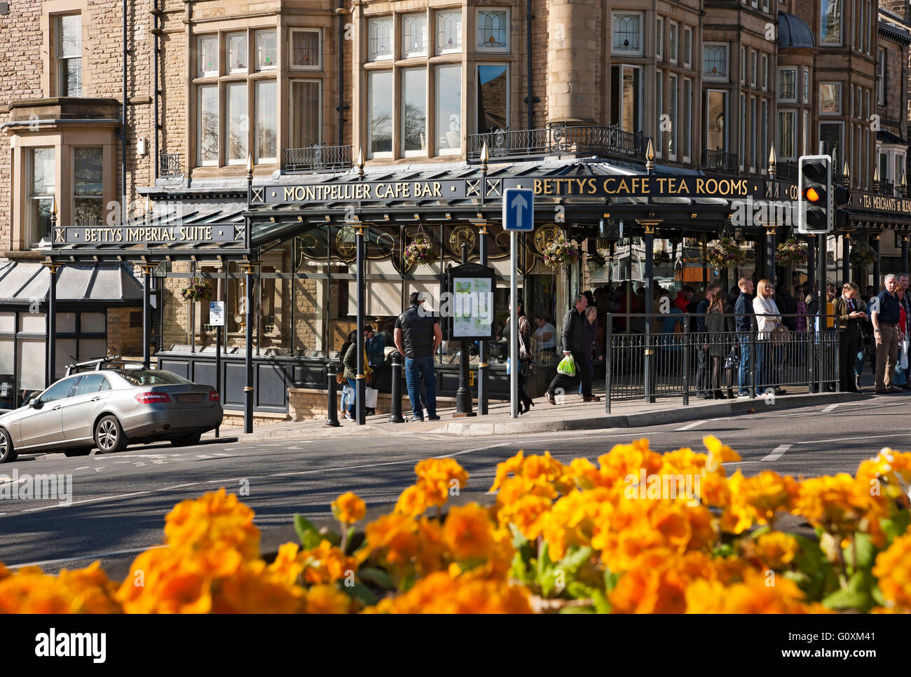 People outside Bettys cafe and tea rooms shop store in spring Harrogate North Yorkshire England UK United Kingdom GB Great Britain Stock Photo