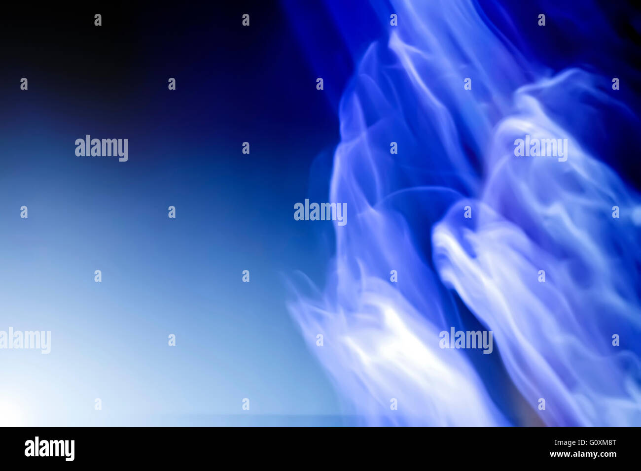 White silhouettes of ghosts on blue background Stock Photo