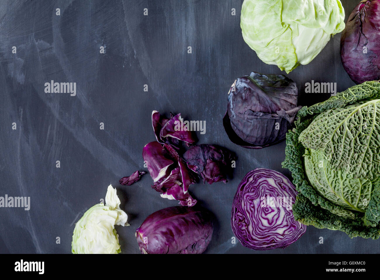 Different cabbages on blackboard from the top with space Stock Photo