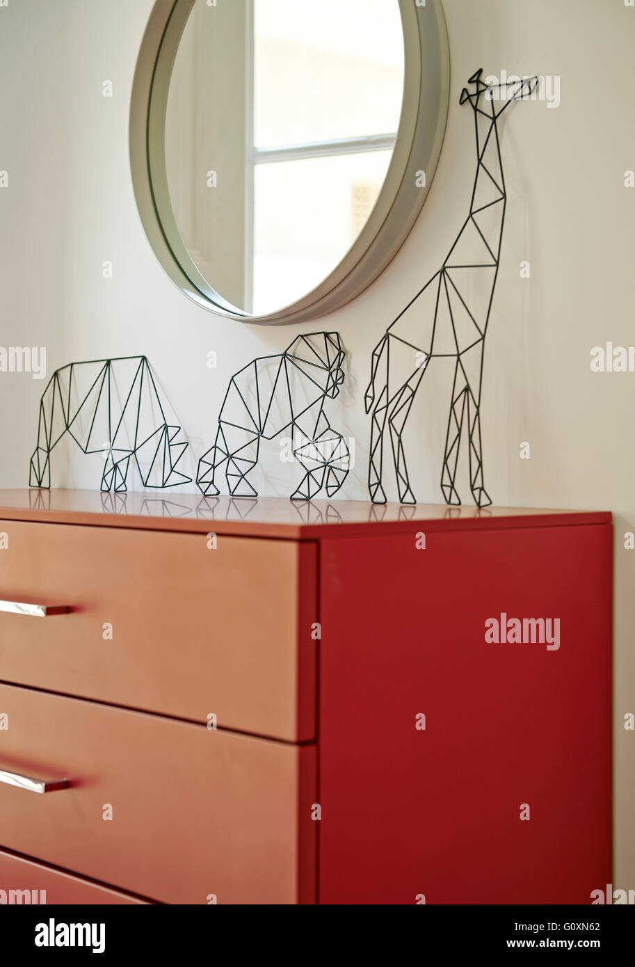 Cervantes Apartment, Barcelona, Spain. Three small animal sculptures, wirework, on a chest of drawers. Stock Photo