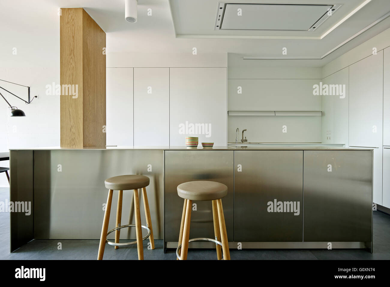 Escorial Apartment. A bar counter and two tall stools Stock Photo Alamy