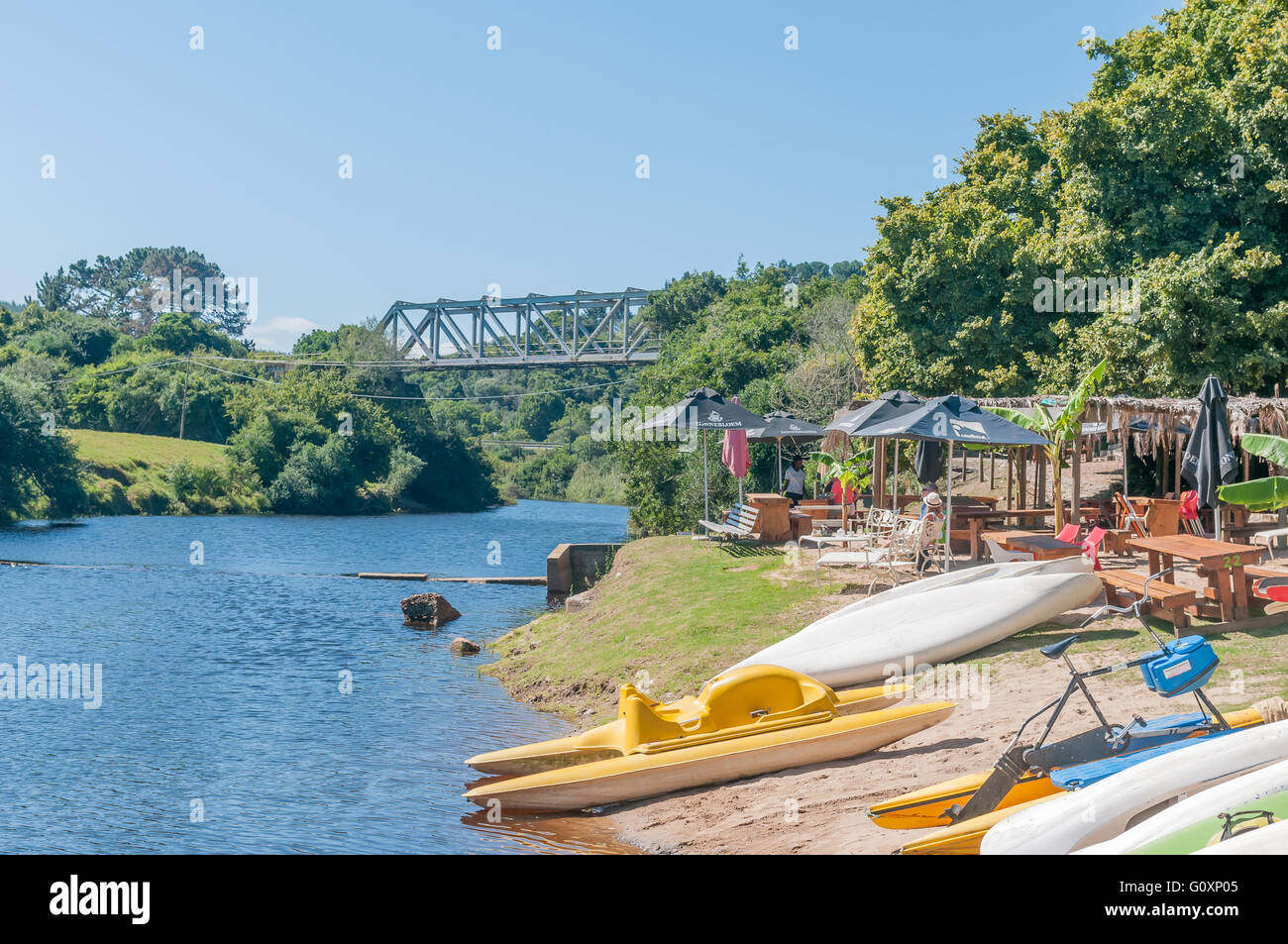 KNYSNA, SOUTH AFRICA - MARCH 3, 2016: A resort next to the Goukamma River with a railway bridge Stock Photo