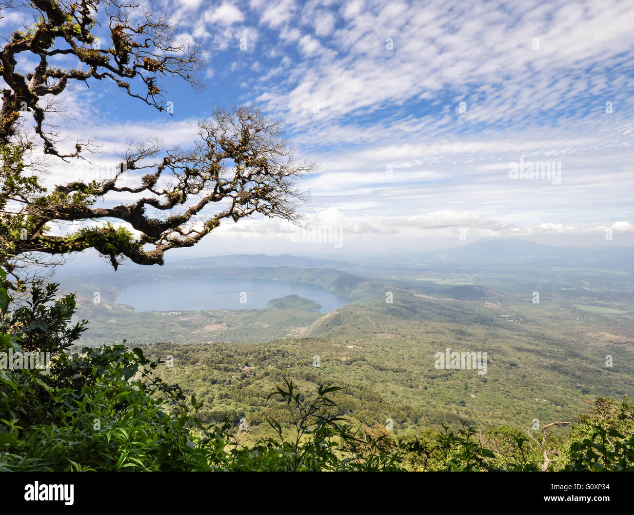 Hazy landscape of the volcanic caldera Lake Coatepeque in Salvador Stock Photo