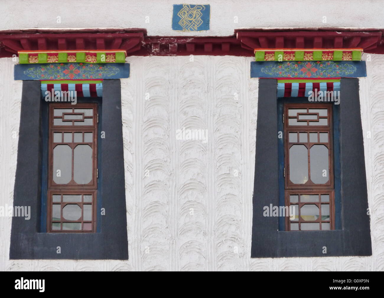 Windows with colourful and traditional Tibetan design in Lhasa, Tibet. Stock Photo