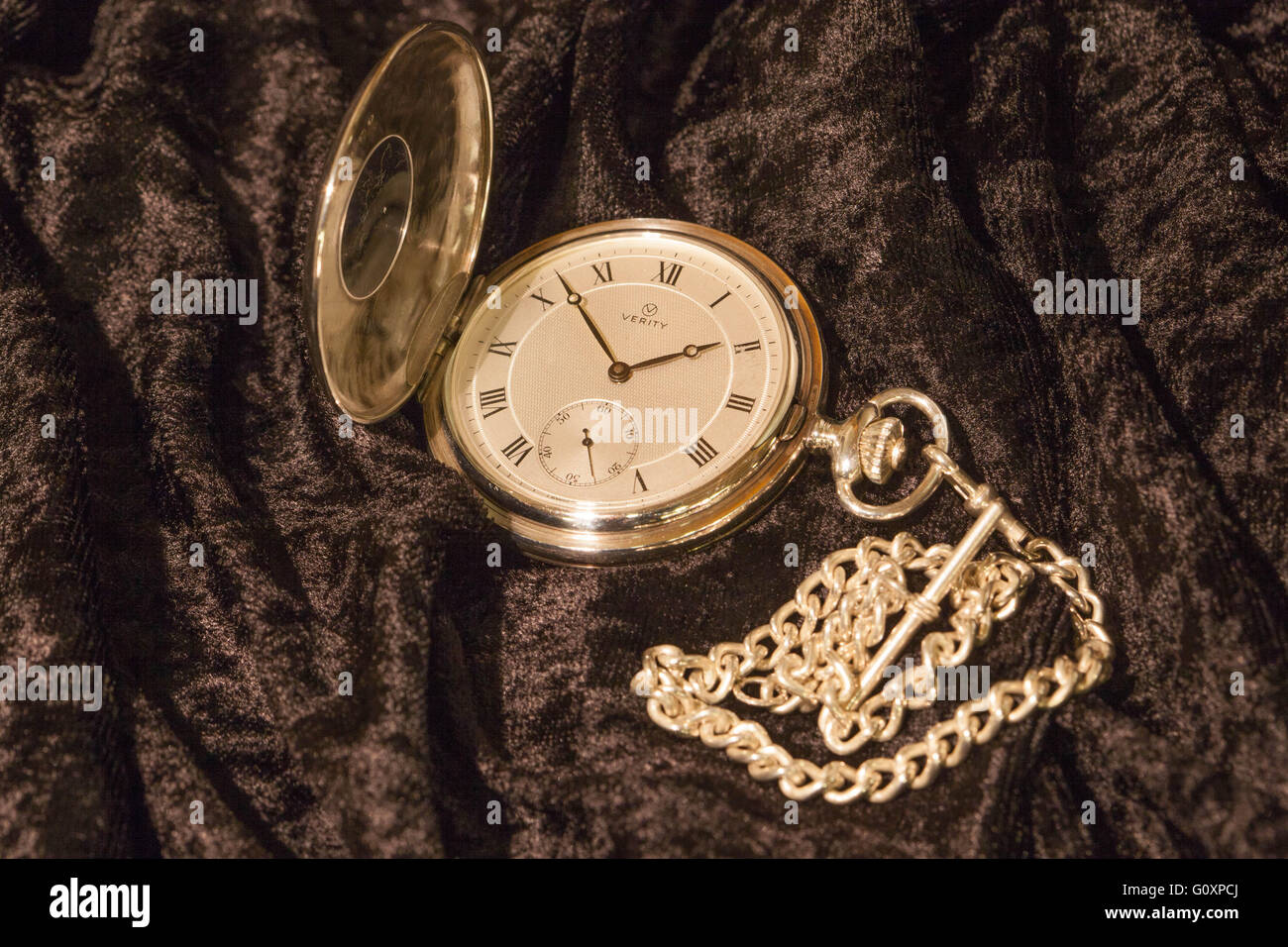 A open pocket watch and chain Stock Photo
