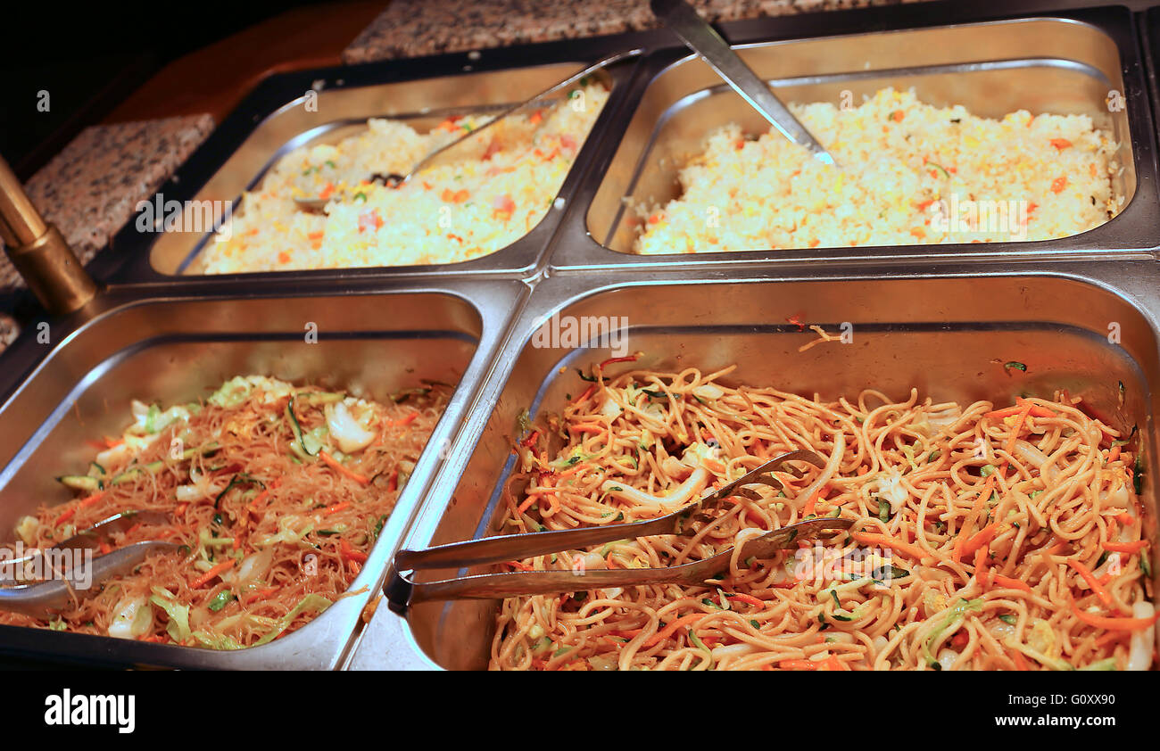 many kinds of pasta noodles and rice in the buffet industrial cafeteria Stock Photo