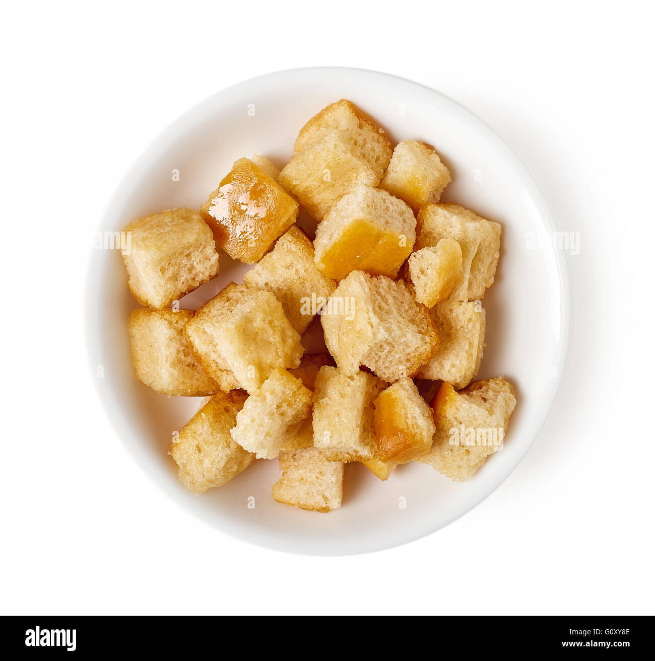 Bowl of croutons isolated on white background, top view Stock Photo