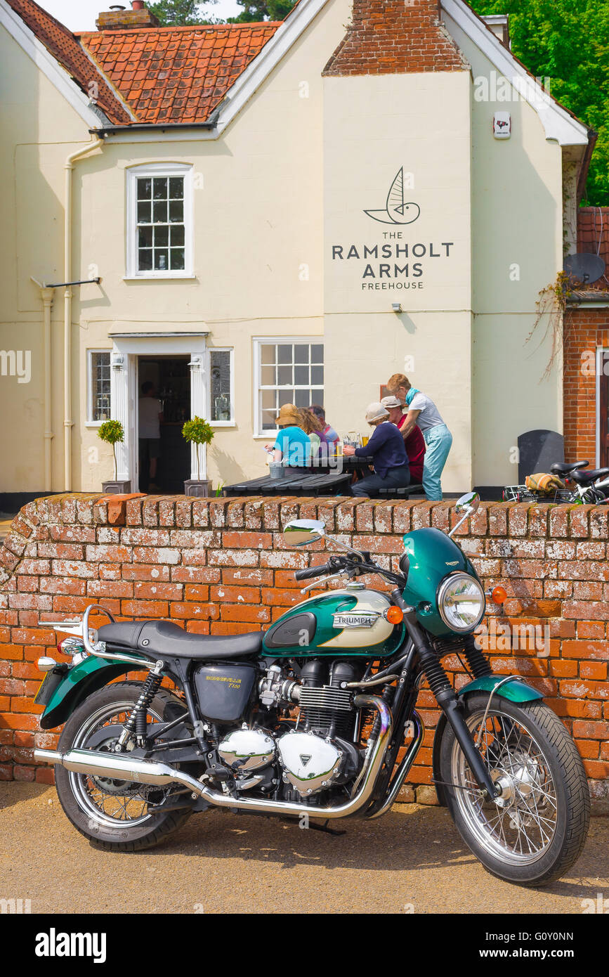 England country pub, view of a Triumph motorcycle parked outside a pub in Ramsholt, Suffolk, England. Stock Photo