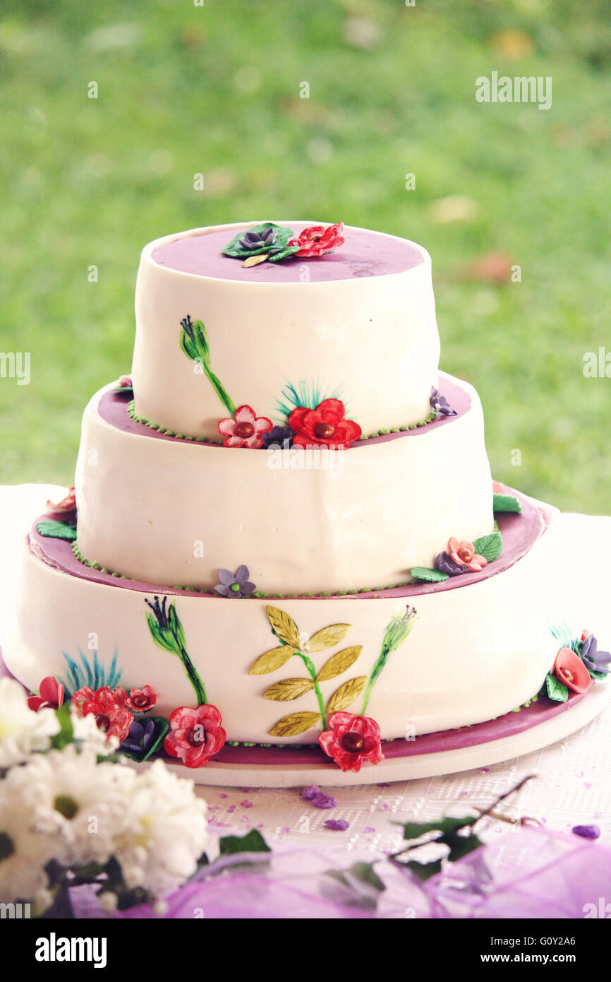Beautiful white wedding cake on table Stock Photo