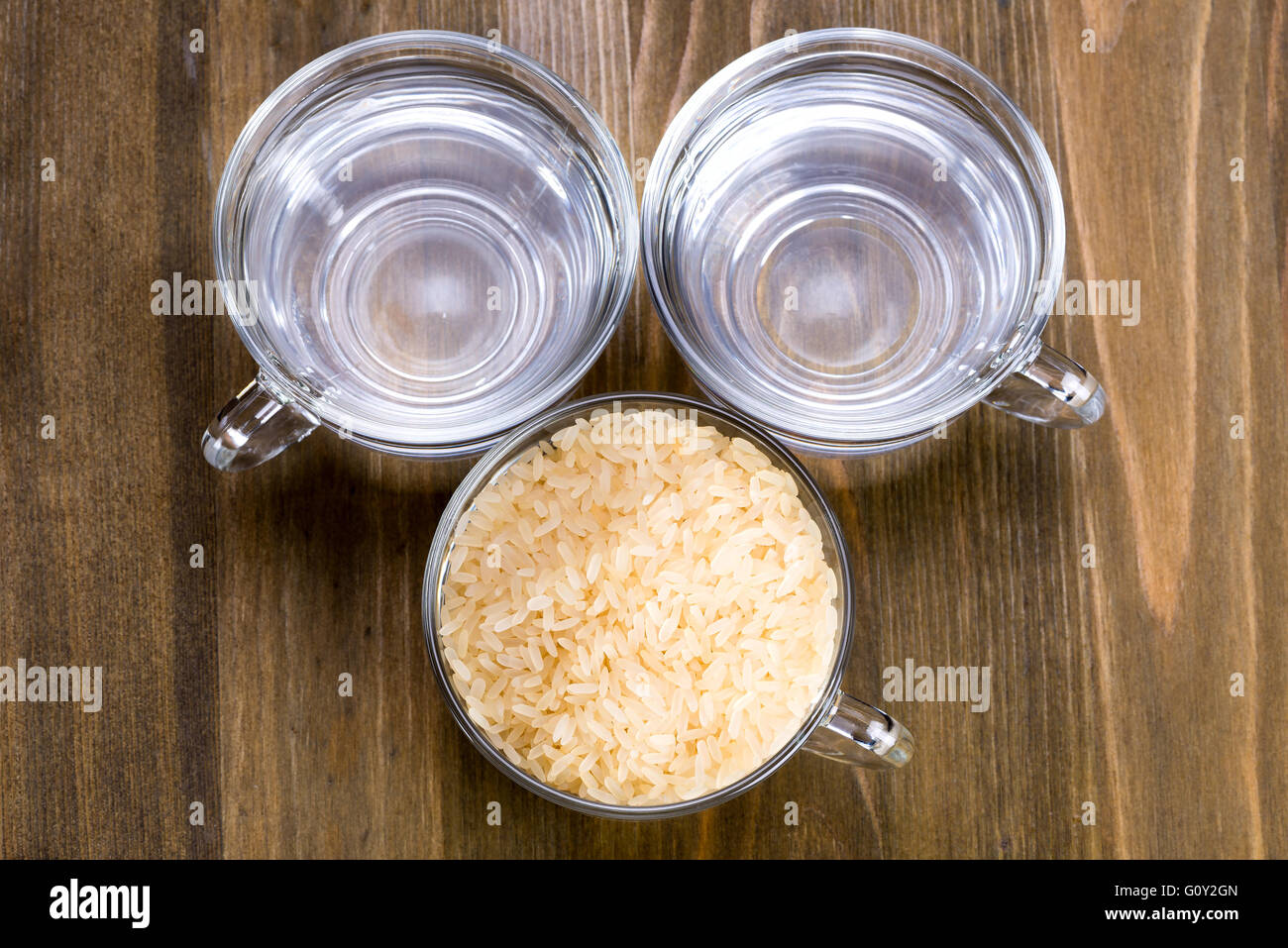 The recipe for steamed rice. One cup of rice and two cups of water