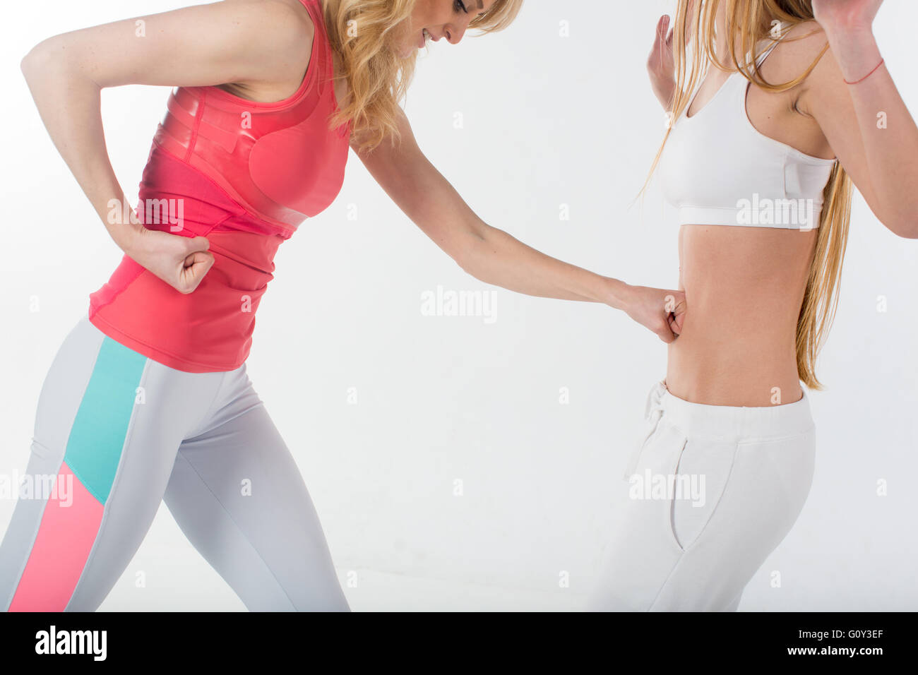 Two women athletes fighting in gym Stock Photo