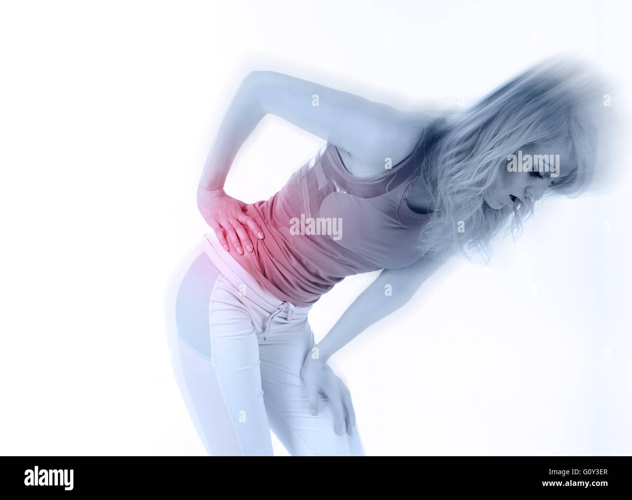 Woman athlete bent over in pain with side stitch cramp Stock Photo