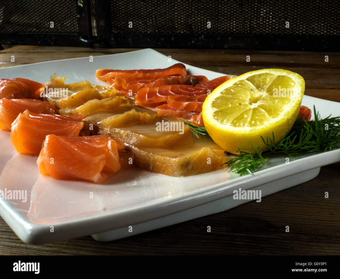 Slices of salmon and starry sturgeon fish on plate, Ukraine Stock Photo