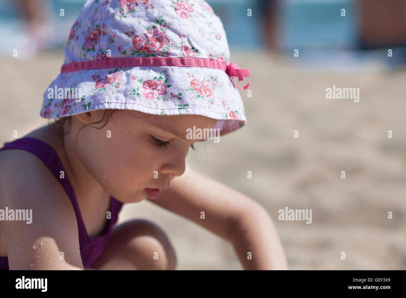 Girl playing on the beach Stock Photo