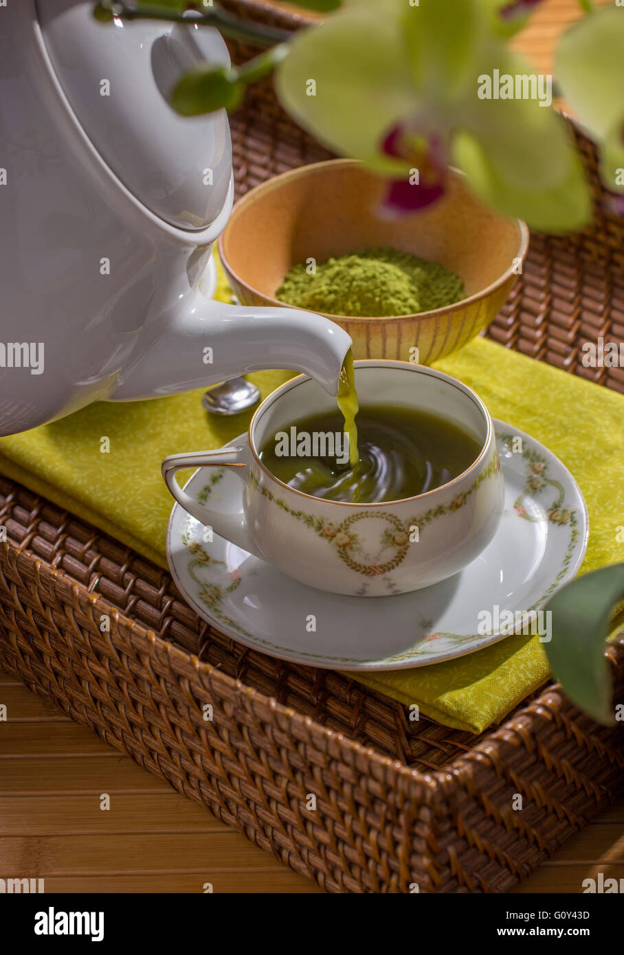 Teapot Pouring Matcha Green Tea into Teacup Stock Photo Alamy