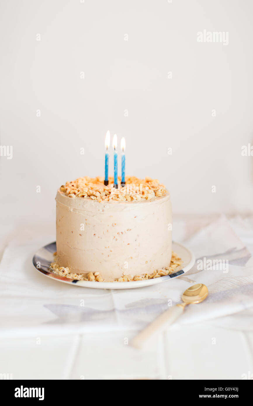 Birthday cake with three candles Stock Photo - Alamy