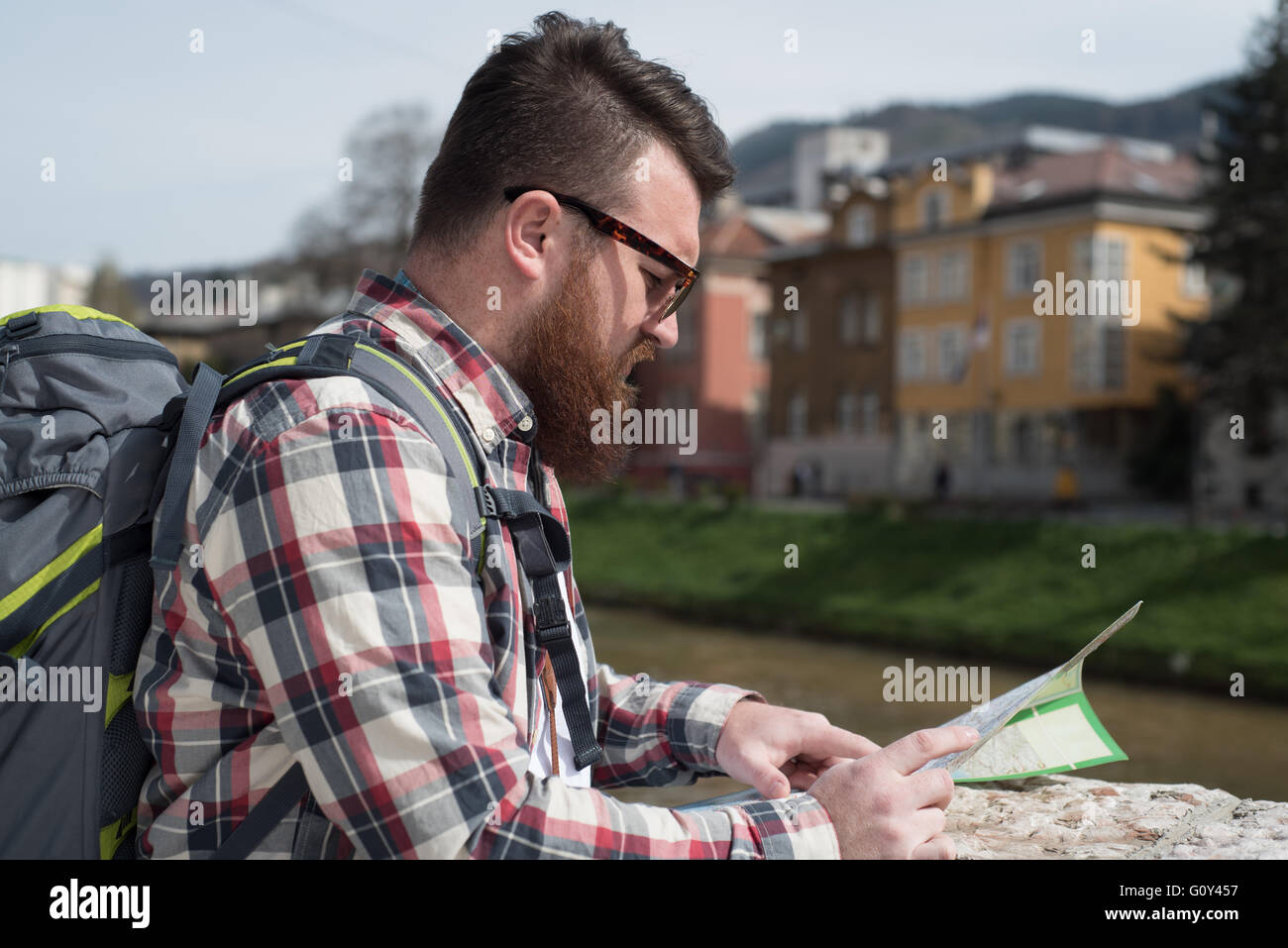 Man looking at tourist map Stock Photo