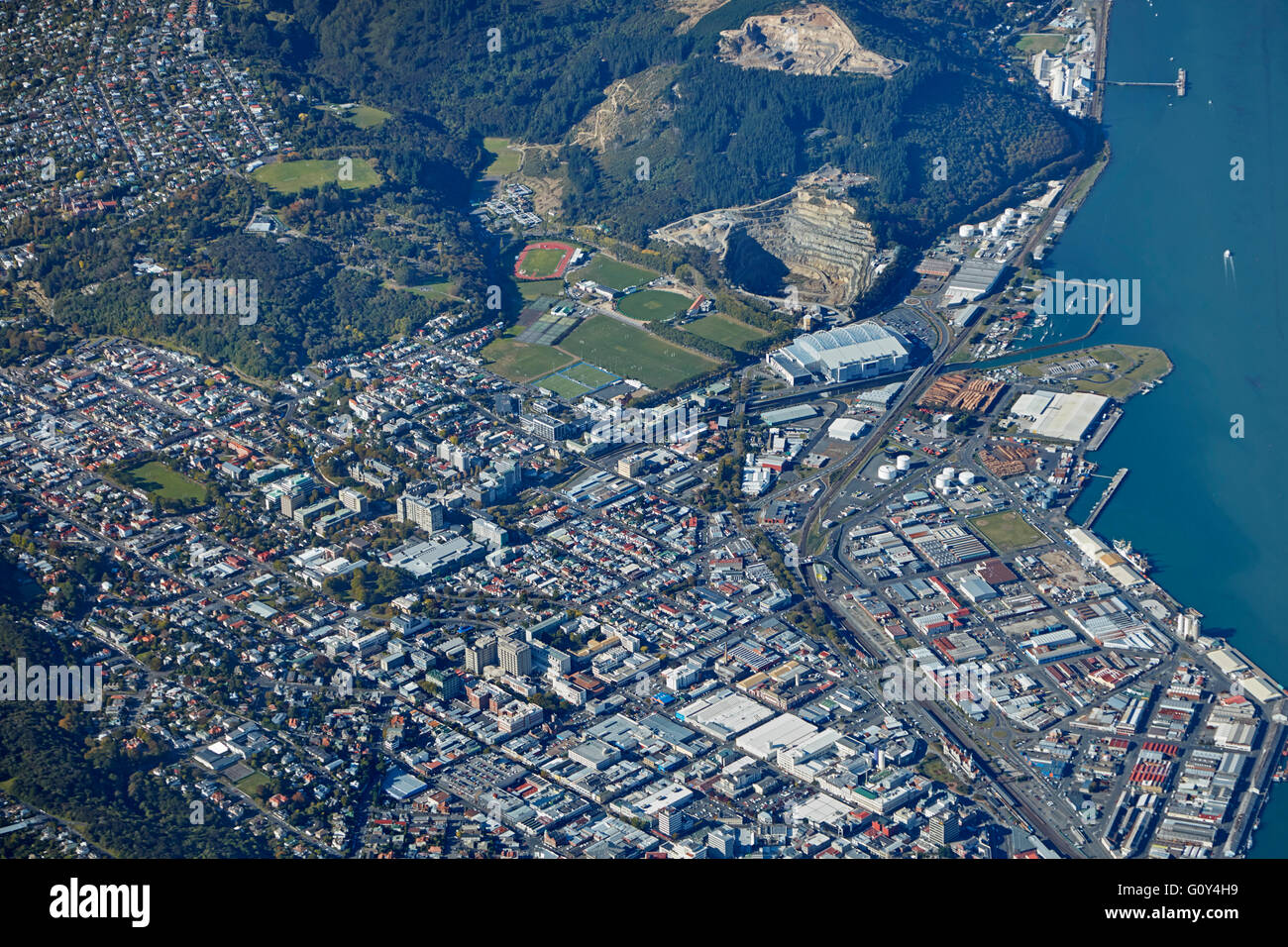 University of Otago, Hospital, Stadium and Otago Harbour, Dunedin, Otago, South Island, New Zealand - aerial Stock Photo