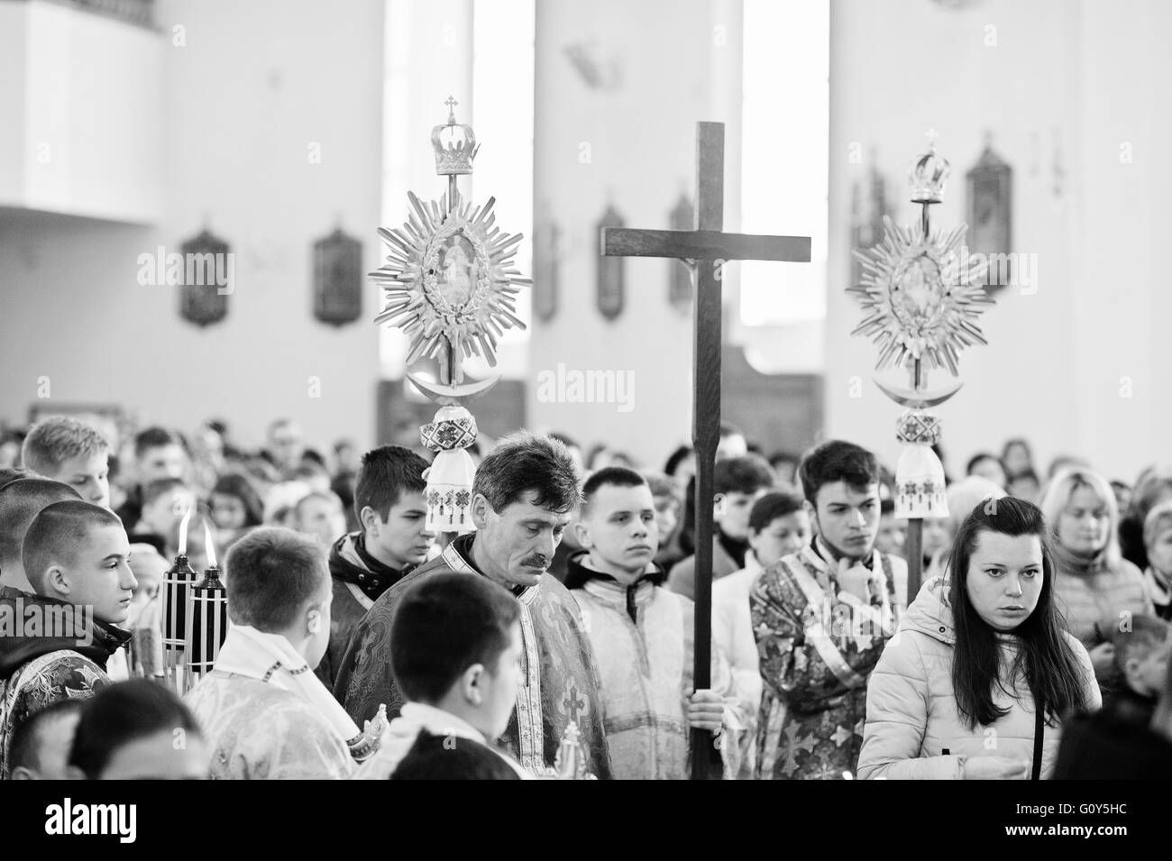 LVIV, UKRAINE - APRIL 27, 2016: Holy Week passion and death of Jesus Christ. Novices children  in  catholic church. Black and wh Stock Photo