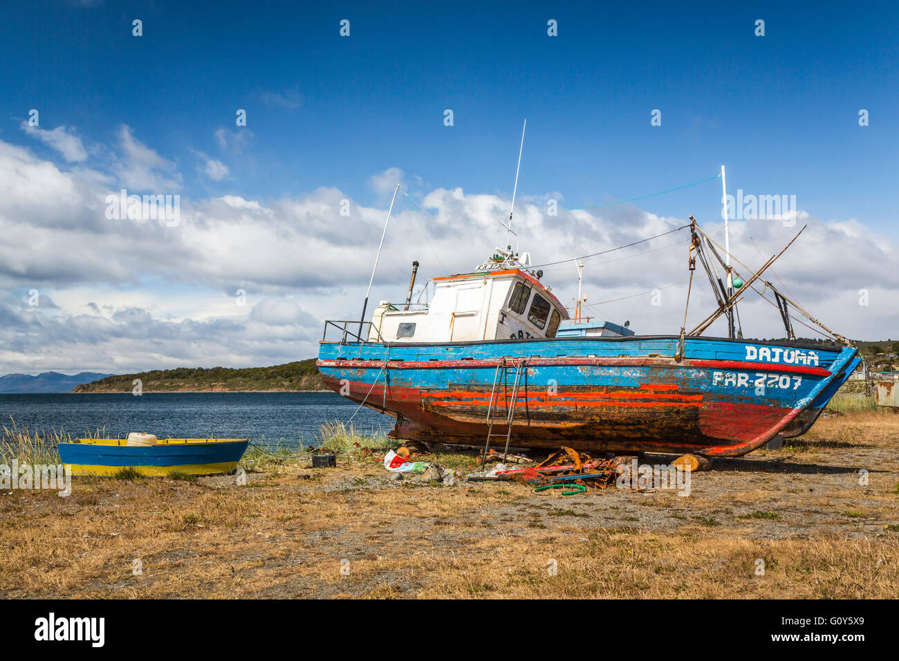 Old fishing boats on the coast on the Strait of Magellan at Punta Carrera, Patagonia, Chile, South America. Stock Photo