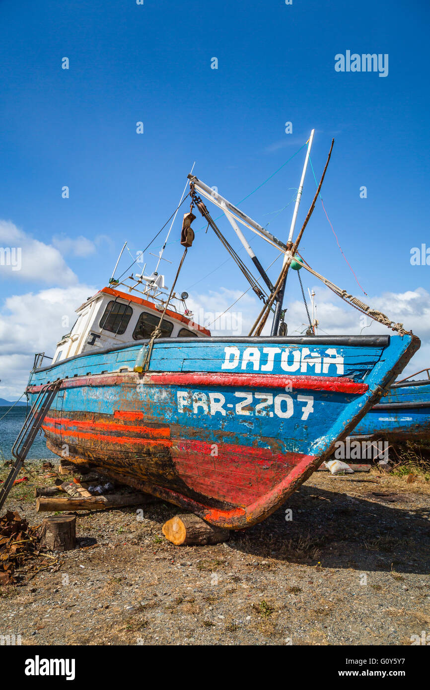 Old fishing boats on the coast on the Strait of Magellan at Punta Carrera, Patagonia, Chile, South America. Stock Photo