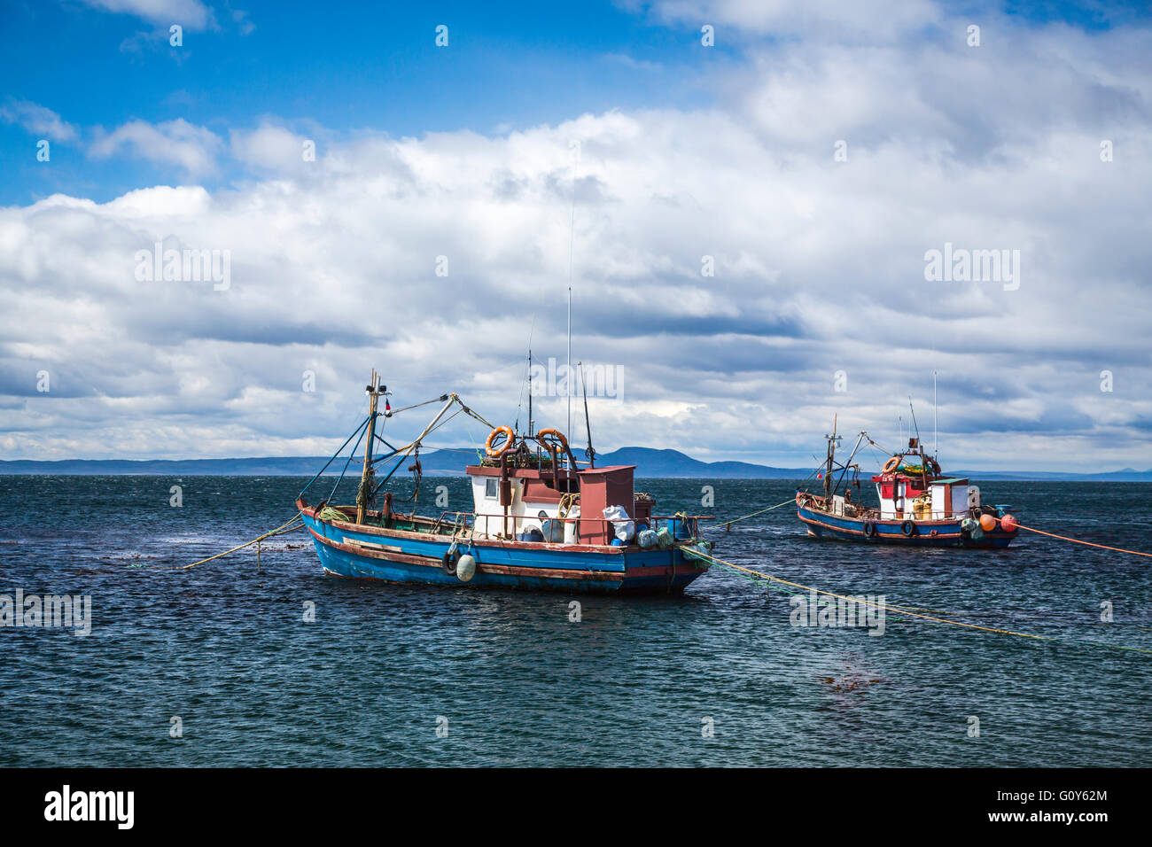 Old fishing boats on the coast on the Strait of Magellan at Punta Carrera, Patagonia, Chile, South America. Stock Photo