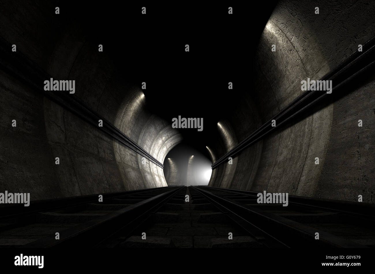 A brick underground train tunnel  that splits into two directions with an apparent train approaching around the corner Stock Photo