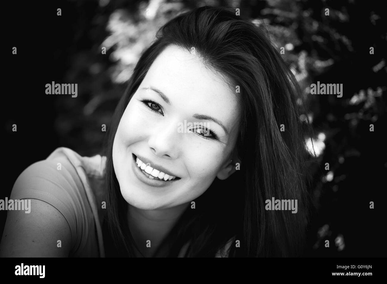 Black And White Portrait Of A Happy Smiling Woman Outside Stock Photo ...