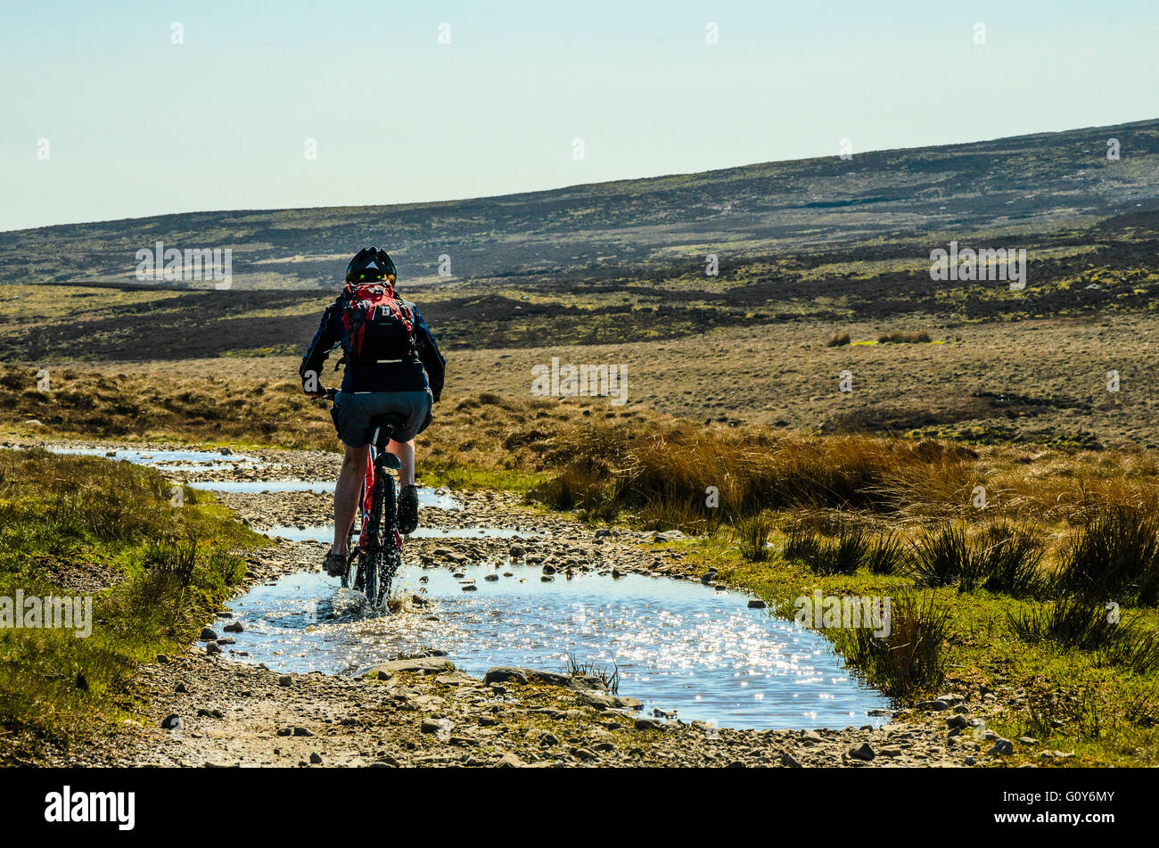 Mountain biker on track across the Bowland Fells Lancashire variously known as Salter’s Way Salter Fell Road or Hornby Road Stock Photo