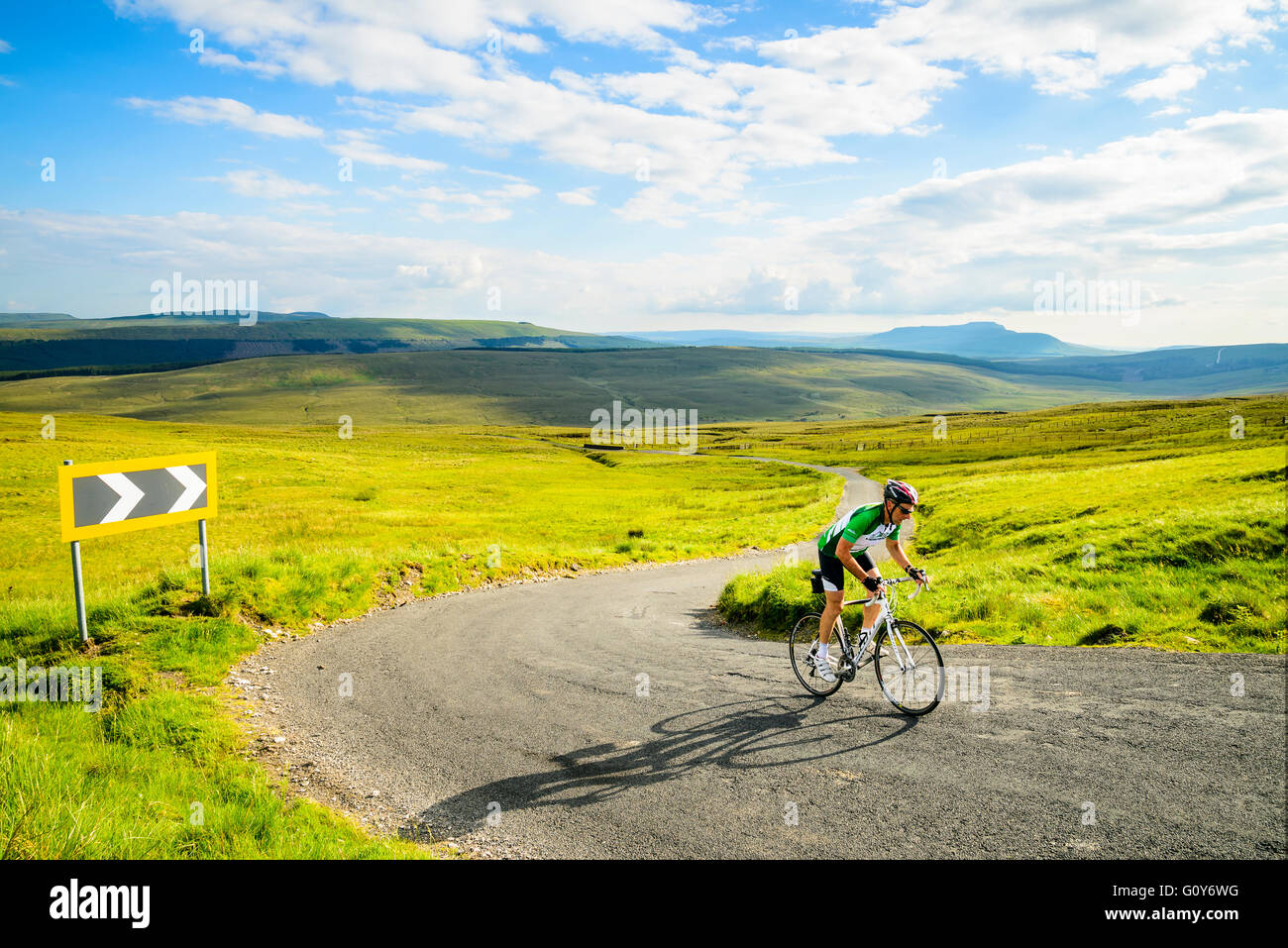 Cyclist near the top of Fleet Moss, the highest road in Yorkshire, with