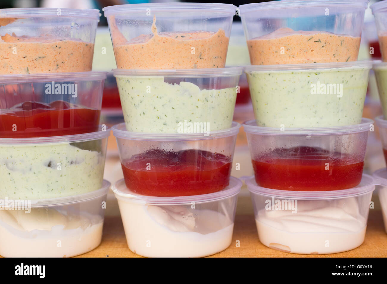 sauces in plastic containers for buffet Stock Photo Alamy