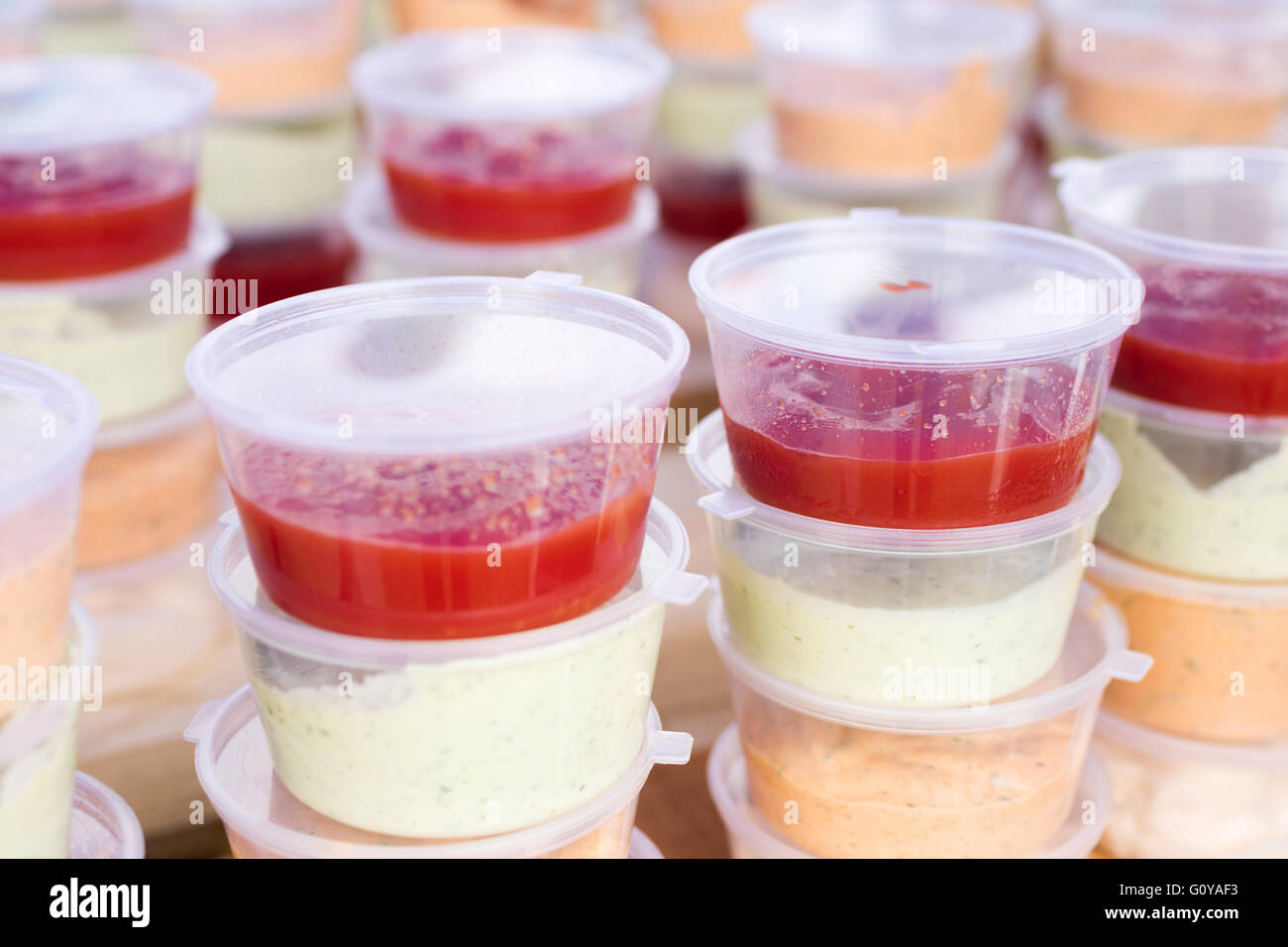 sauces in plastic containers for buffet Stock Photo Alamy