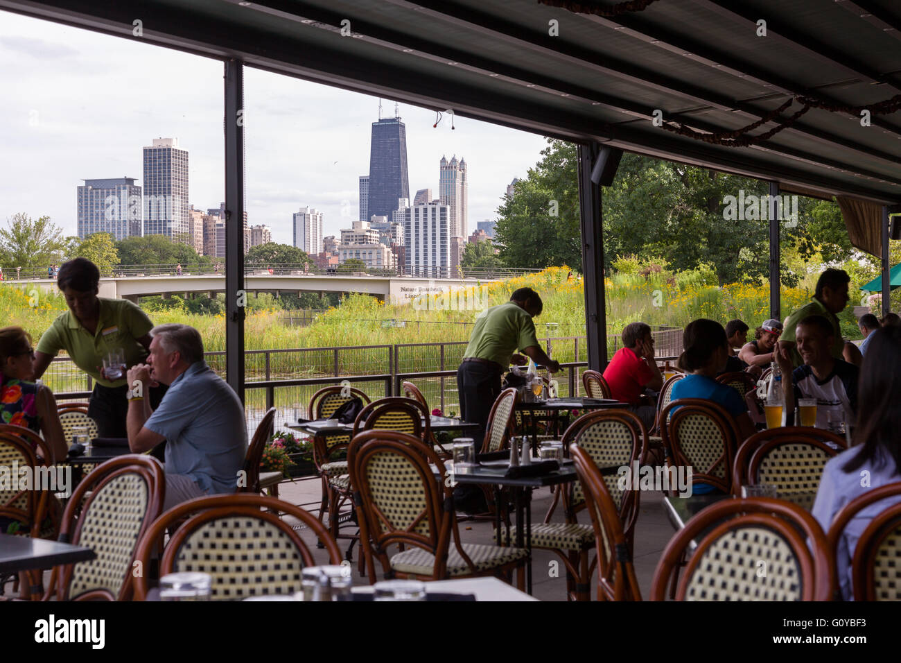 Patrons enjoy the outdoor cafe at the North Pond restaurant in Lincoln Park on a summers day in Chicago, Illinois, USA Stock Photo