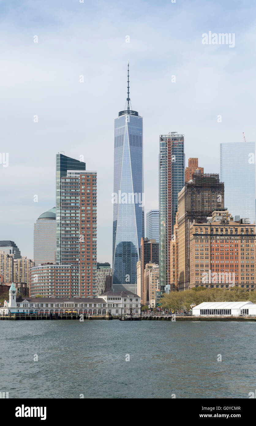 View of the Financial District / Battery Park City and One World Trade Center (Freedom Tower) behind Battery Park Stock Photo