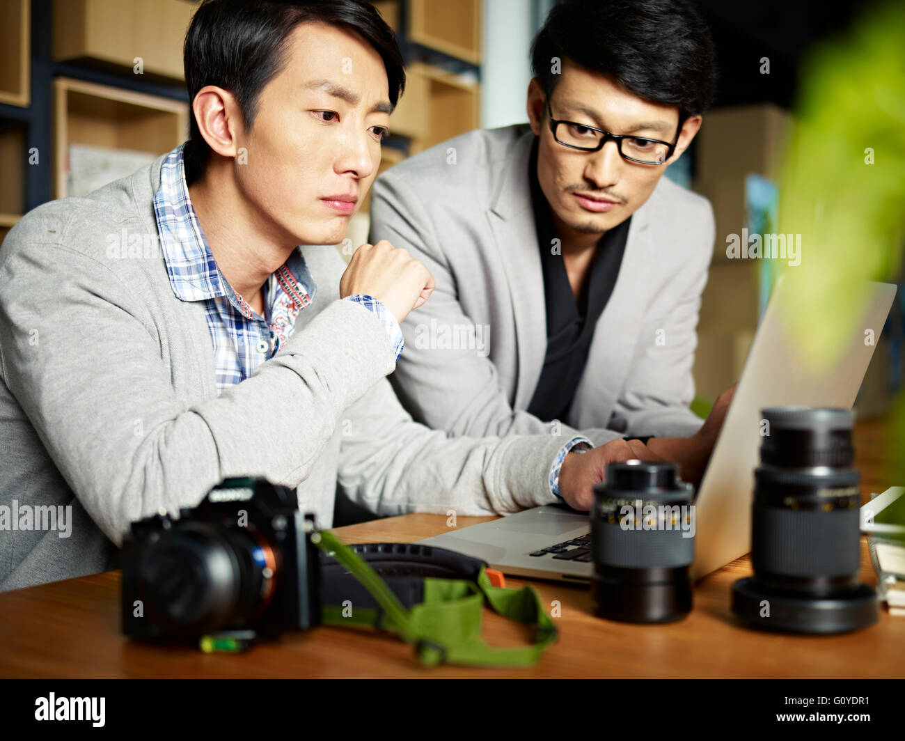two photographers working in studio Stock Photo
