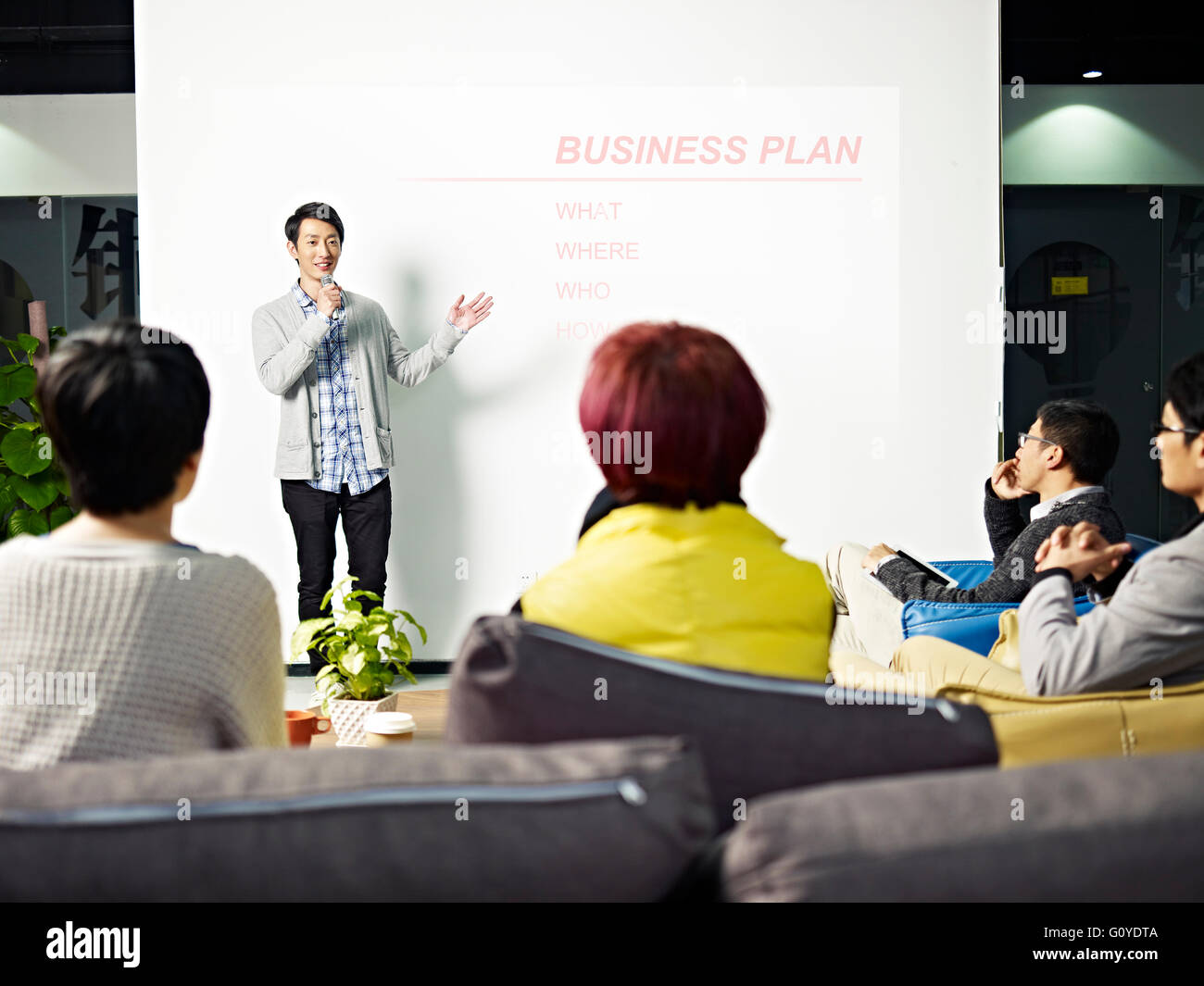 young asian entrepreneur presenting business plan for new project. Stock Photo