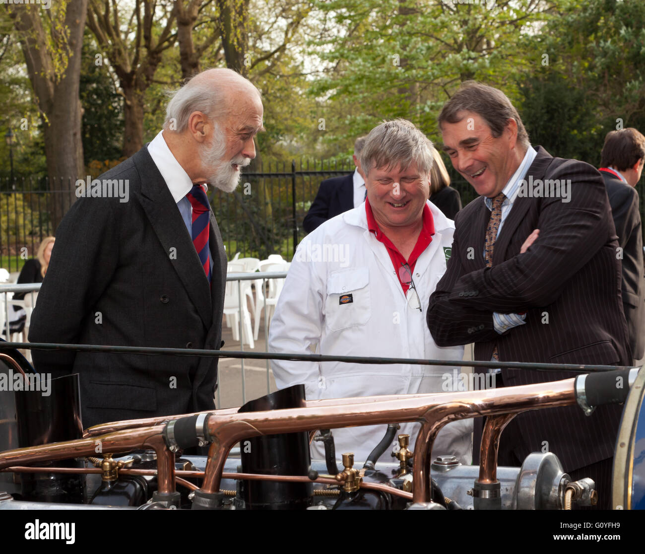 Nigel Mansell and Prince Michael of Kent being shown Malcolm Campbell's world record breaking 350HP V12 Sunbeam Bluebird, by Ian Stanfield, Senior Engineer at the National Motor Museum, Beaulieu. During the Trade and Press day of the 2016 London Motor Show. Stock Photo