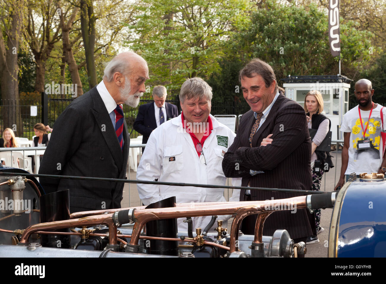 Nigel Mansell and Prince Michael of Kent being shown Malcolm Campbell's world record breaking 350HP V12 Sunbeam Bluebird, by Ian Stanfield, Senior Engineer at the National Motor Museum, Beaulieu. During the Trade and Press day of the 2016 London Motor Show. Stock Photo