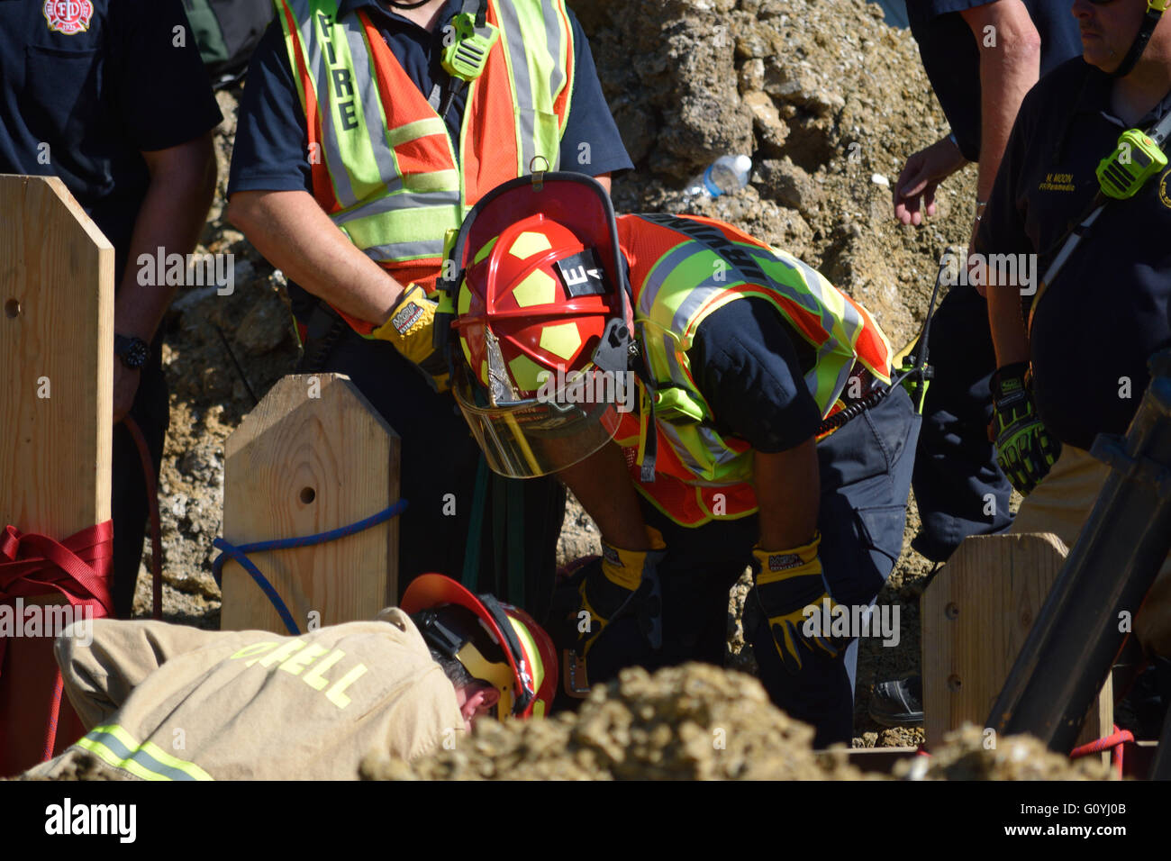Irving, TX, USA. 5th May, 2016. Rescue workers help dig out a construction worker who was trapped in a twelve foot deep ditch. Credit:  Brian Humek/Alamy Live News. Stock Photo