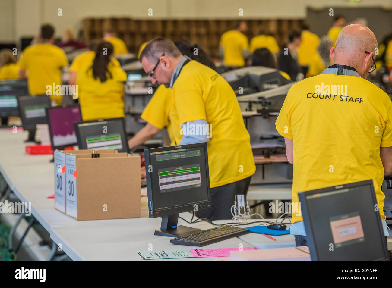London, UK. 6th May, 2016. The DRS count machines operated by colour coded count staff - The counts for the Mayor of London and Assembly members is carried out by a mixture of machines and people at Olympia, London. The machines are run by DRS, Data & research Services plc. Credit:  Guy Bell/Alamy Live News Stock Photo