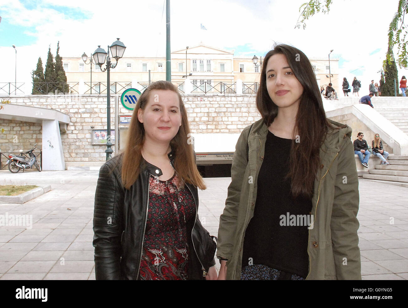 Students Elena (27) and Juli (R, 25) stand in front of the Greek parliament building on Syntagma Square in Athens, 05 May 2016. Both women feel that the previous generations screwed up. They are pessimistic about their own future. They could go abroad, but they wouldn't be welcomed with open arms there. Elena thinks that the Greek crisis is not only economic, but also ethical and moral - the people have to learn have to stick together better. Photo: Alexia Angelopoulou/dpa Stock Photo