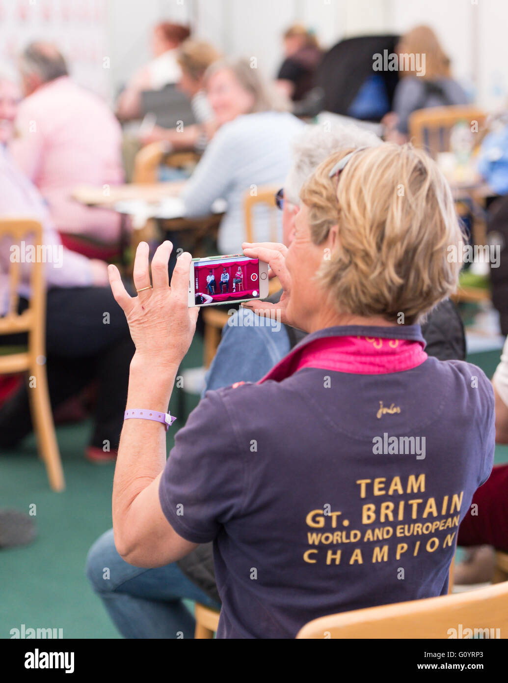 Badminton, South Gloucestershire, UK,  6th May 2016, Mary King filmes her Daughter Emily King at the press conference. Emily is in secomd place following the dressage phase of the Mitsubishi Motors Badminton Horse Trials 2016. Dressage is an advan. Credit: Trevor Holt / Alamy Live News Stock Photo